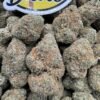Truffle Candy Pop Indoors premium cannabis flower with frosty trichomes, dense buds, sweet candy flavor hybrid strain, high THC indoor weed