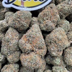 Truffle Candy Pop Indoors premium cannabis flower with frosty trichomes, dense buds, sweet candy flavor hybrid strain, high THC indoor weed