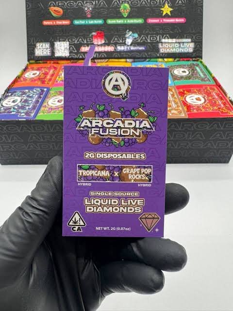Open Authentic Arcadia Fusion master case containing ten color-coded Liquid Live Diamonds disposable varieties