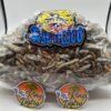 Large bag of dried mushrooms labeled School Teacher shrooms with pale stems, brown caps, and blue-gray bruising