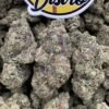 Strawberry Guavaz THC weed showing dense frosty cannabis buds with green and purple colours