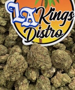 Close-up of Blue Zushi Lows cannabis flower buds beneath the LA Kings Distro logo