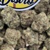Green Cookie Monster Lows cannabis flower buds with orange pistils beside the LA Kings Distro logo