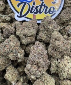 Frosty olive green and purple Gorilla Butter Lows cannabis buds beside the LA Kings Distro logo