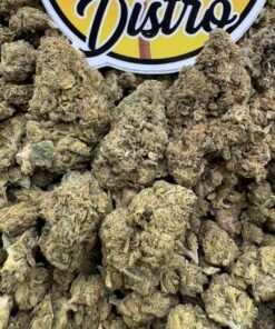 Close-up of chunky green Toxic Lemon Lows cannabis buds beneath the LA Kings Distro sign