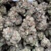 Frosty green and violet Cherry Zlushie cannabis flower buds with copper-orange pistils