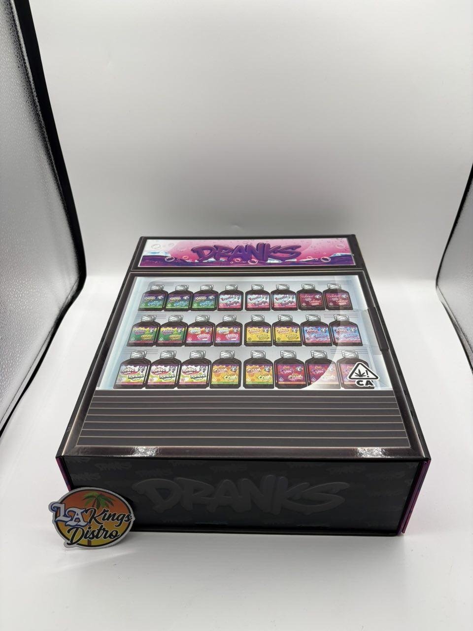 Authentic Dranks 2G disposable vape display box with assorted dual-flavor devices and LA Kings Distro logo Authentic Dranks 2G disposable vape display box with assorted dual-flavor devices and LA Kings Distro logo
