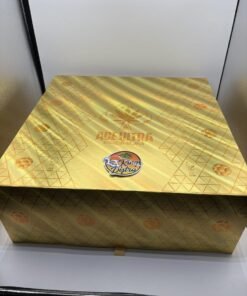Open gold soccer-ball case holding an Authentic Ace 2G Disposable World Cup Edition device and collectible ring