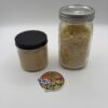 Affordable badder and sugar concentrates displayed in glass jars with creamy and granular textures