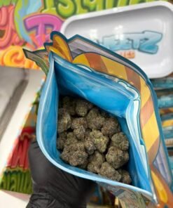 Sweetz Exotics 1LB premium cannabis flower variety box with 16 pre-packed 1oz strains and pink teal packaging