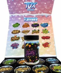 Open TUX Snowcaps display case with sixteen one-ounce jars of assorted exotic indoor cannabis flower