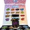 Open TUX Snowcaps display case with sixteen one-ounce jars of assorted exotic indoor cannabis flower