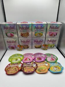 Authentic PolkaDot 4G Vegan Magic Gummies boxes and assorted fruit flavor pouches including Lychee, Tokyo Grape, Watermelon and Pina Colada