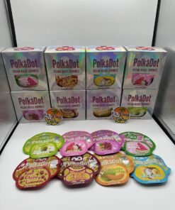 Authentic PolkaDot 4G Vegan Magic Gummies boxes and assorted fruit flavor pouches including Lychee, Tokyo Grape, Watermelon and Pina Colada