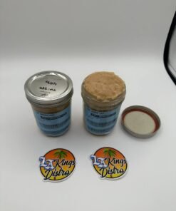 Cat 3 licensed cannabis badder concentrate in glass jars showing creamy golden-tan texture