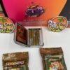 Open Sluggers Hit collectible tin showing five infused JUICED pre-rolls with Sluggers packaging in background