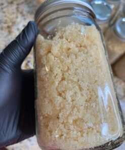 Cat 3 Clean Lab Tested Sugar cannabis concentrate in bulk glass jars with light golden crystalline texture