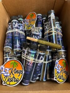 Authentic Cake Pre Rolls in holographic individual tubes with premium rolled pre-roll displayed