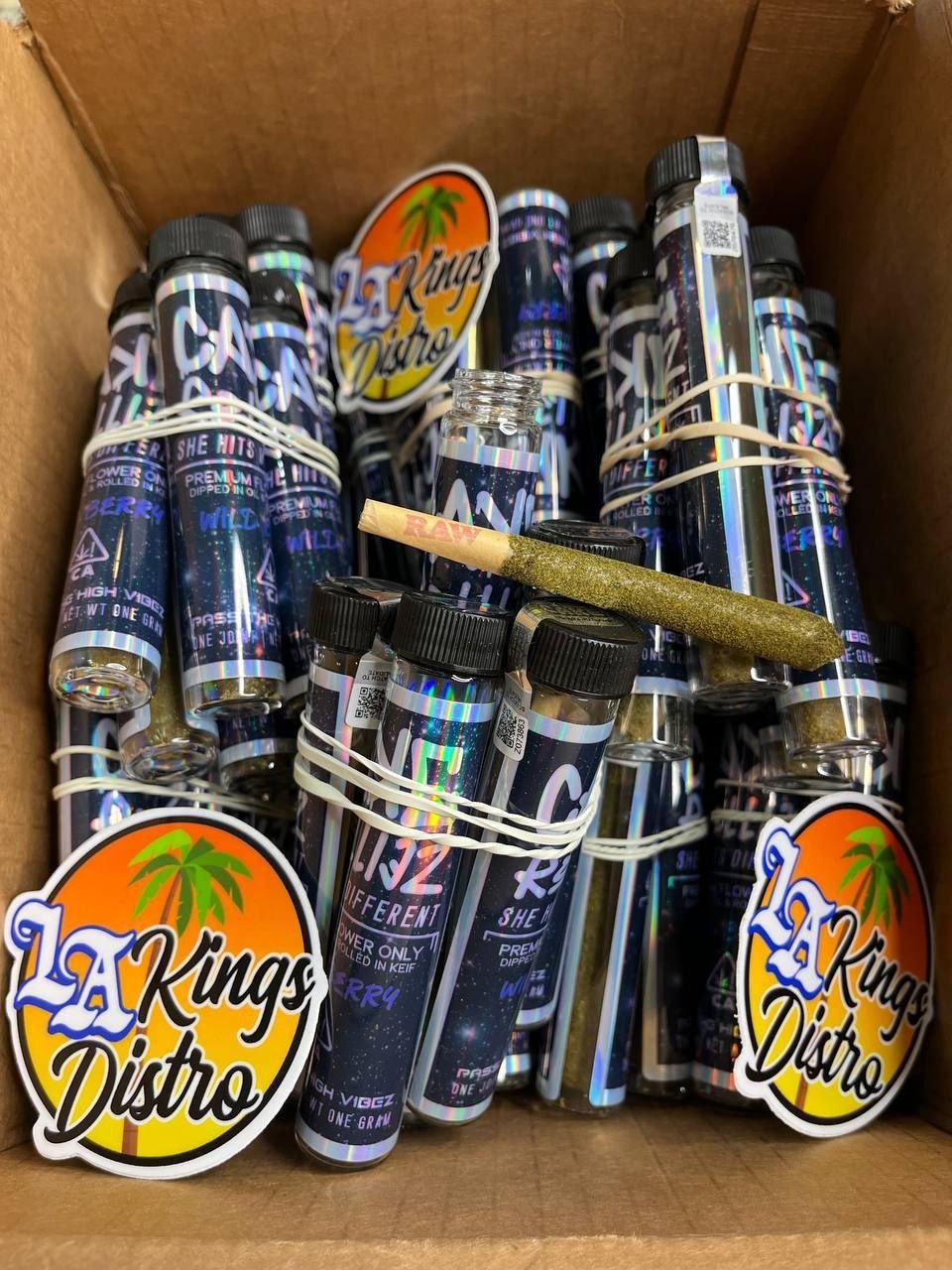 Authentic Cake Pre Rolls in holographic individual tubes with premium rolled pre-roll displayed