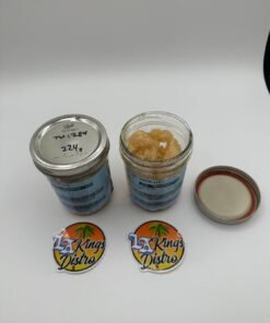 Cat 3 licensed lab-tested cannabis sugar concentrate displayed in glass jars with golden crystal texture