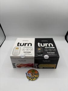 Turn One 2G disposable vapes displayed with Magic Melon and White Gummy Bear Botanica Blends packages