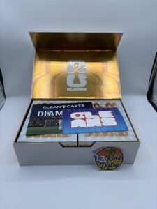Authentic Clean Carts 2G Liquid Diamonds + Live Resin disposable vape display box with assorted flavors and Clean Carts devices.