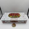 Authentic Faded Fruits 2G dual-flavor disposable vape with coral body and gold-toned mouthpiece