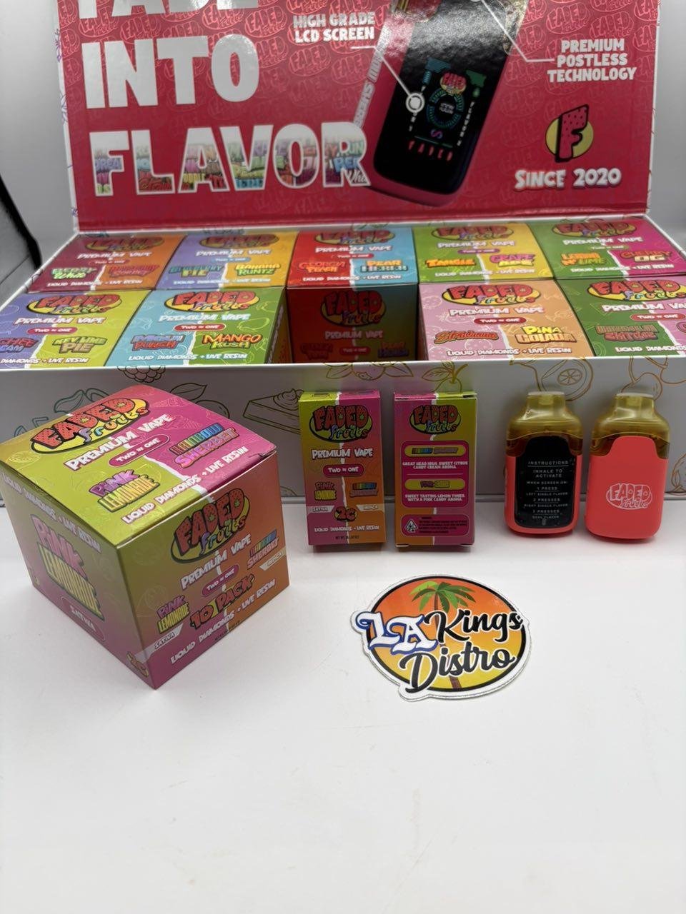 Faded Fruits Premium Vape device displayed with Two in One retail boxes and wholesale case Faded Fruits Premium Vape device displayed with Two in One retail boxes and wholesale case