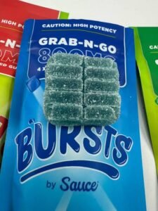 Authentic Bursts by Sauce 800MG Nano Live Resin Gummies display with assorted flavor packaging